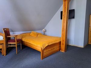 Postel nebo postele na pokoji v ubytování Dom Gościnny