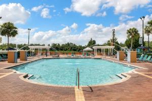 a large swimming pool at a resort at 4 Bedroom 3 Bathroom Villas At Seven Dwarfs 10-102 in Kissimmee