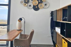 a dining room with a table and a chair at Villa SolyMar in Polop Hills Luxury and comfort ! in Polop