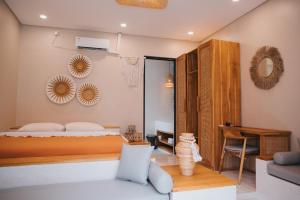 Ένα ή περισσότερα κρεβάτια σε δωμάτιο στο Berutz Villa Canggu +83 φωτογραφίες