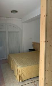 A bed or beds in a room at Lilium Villa Hévíz
