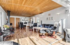a living room with a couch and a table at Awesome Home In Vemb With Kitchen in Vemb