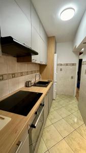 a kitchen with a sink and a stove top oven at Rooms in Warsaw - C116-118 in Warsaw