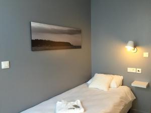 Postel nebo postele na pokoji v ubytování Au Bout Du Quai