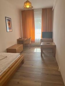 TV a/nebo společenská místnost v ubytování City Hotel Post 15
