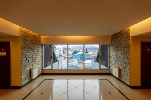 a large room with a large window with a view at Gente del Sur - Towers in Ushuaia