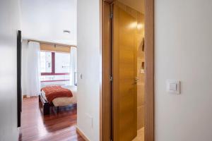 Łóżko lub łóżka w pokoju w obiekcie Apartamento Lua
