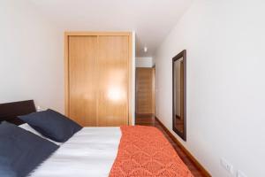 Łóżko lub łóżka w pokoju w obiekcie Apartamento Lua