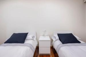 Łóżko lub łóżka w pokoju w obiekcie Apartamento Lua