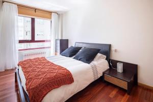 Łóżko lub łóżka w pokoju w obiekcie Apartamento Lua