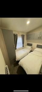 Postel nebo postele na pokoji v ubytování DW Serenity Cabin + 18 fotografií