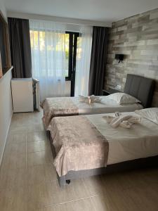 Postel nebo postele na pokoji v ubytování Hotel Selena Boutique + 7 fotografií