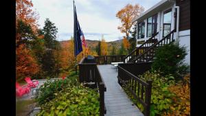 a porch with a flag on a house at Welch View 68, T in Thornton