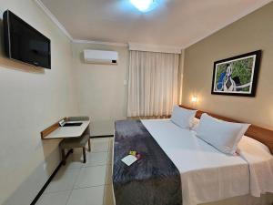 Postel nebo postele na pokoji v ubytování Cedro Hotel