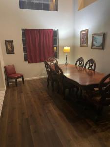 a dining room with a wooden table and chairs at Master Bedroom inside a Gorgeous Home in a Beautiful Neighborhood in Las Vegas