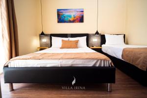 Postel nebo postele na pokoji v ubytování Villa Irina