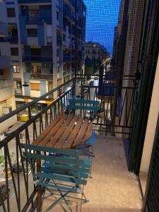 a bench sitting on the balcony of a building at Manzoni 116 in Bari
