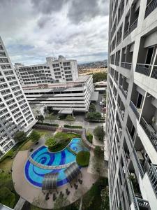 an aerial view of a courtyard between two buildings at Cozy Condo in Taguig in Manila +33 photos
