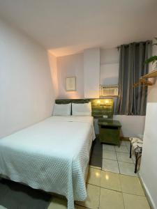 Ένα ή περισσότερα κρεβάτια σε δωμάτιο στο Velvet hotel centro histórico