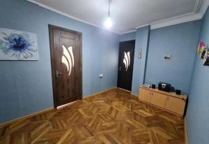an empty room with a wooden floor and a door at Terrace on Orbeliani in Tbilisi City