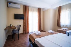 Postel nebo postele na pokoji v ubytování Villa Irina