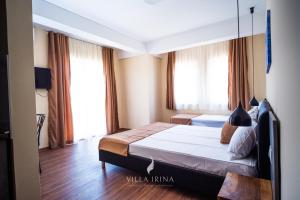 Postel nebo postele na pokoji v ubytování Villa Irina