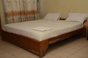 Postel nebo postele na pokoji v ubytování Hotel Ambassadors