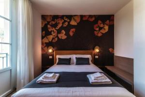 Postel nebo postele na pokoji v ubytování Hotel Ristorante La Vignetta Cernobbio