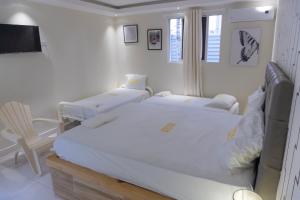 Postel nebo postele na pokoji v ubytování Hotel1325
