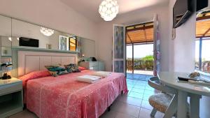 Кровать или кровати в номере Hotel Capo Sud
