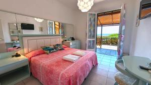 Кровать или кровати в номере Hotel Capo Sud