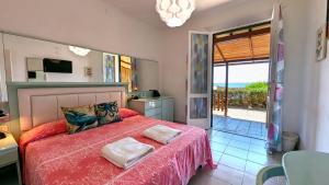 Кровать или кровати в номере Hotel Capo Sud +37 фотографий