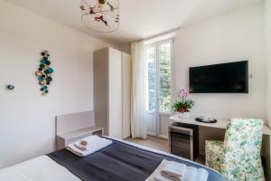 TV a/nebo společenská místnost v ubytování Hotel Ristorante La Vignetta Cernobbio