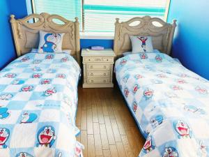 Postel nebo postele na pokoji v ubytování 颯House5