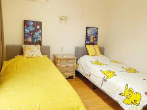 Postel nebo postele na pokoji v ubytování 颯House5