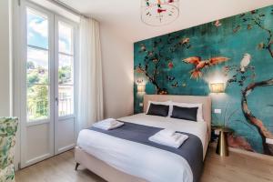 Postel nebo postele na pokoji v ubytování Hotel Ristorante La Vignetta Cernobbio