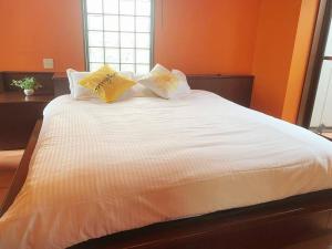 Postel nebo postele na pokoji v ubytování 颯House5