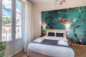 Postel nebo postele na pokoji v ubytování Hotel Ristorante La Vignetta Cernobbio