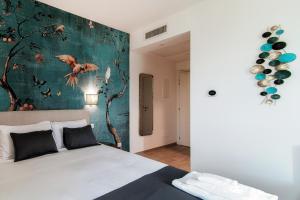 Postel nebo postele na pokoji v ubytování Hotel Ristorante La Vignetta Cernobbio