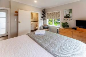 Ένα ή περισσότερα κρεβάτια σε δωμάτιο στο Secret Garden House