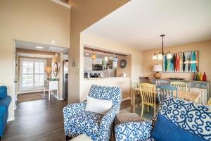 a living room with a couch and a dining room at Serene Lakeview Retreat 3BR Villa Beach Access in Pawleys Island +11 photos