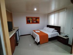 Postel nebo postele na pokoji v ubytování Hotel El Bosque Valledupar + 37 fotografií