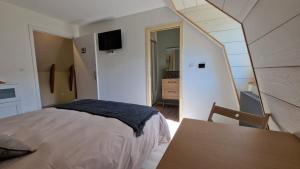 Ένα ή περισσότερα κρεβάτια σε δωμάτιο στο La Lys Martagon