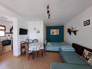 a living room with a couch and a table at Villa Anastasia in Sinemorets