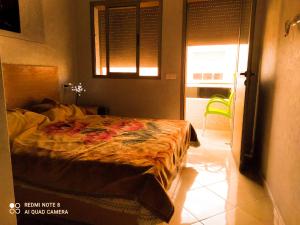 Voodi või voodid majutusasutuse Appartement à Bouznika prêt du plage Dahomey, plage bouznika, Bahia beach toas