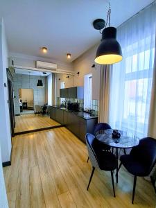 Kuchyňa alebo kuchynka v ubytovaní Apartamenty "BULWAR GORZOW"
