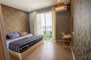 Postel nebo postele na pokoji v ubytování Georgetown Seaview MansionOne @Penang