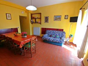 a living room with a couch and a table at Villa Cortinella in Marlia +13 photos