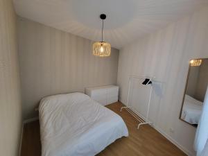 Ένα ή περισσότερα κρεβάτια σε δωμάτιο στο Appartement T2 spacieux de 30m2, idéal proche Paris