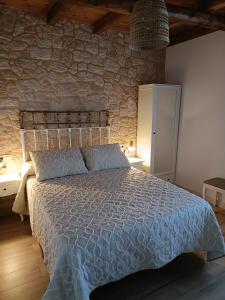 En eller flere senge i et værelse på Casa Rural Rio la Puente